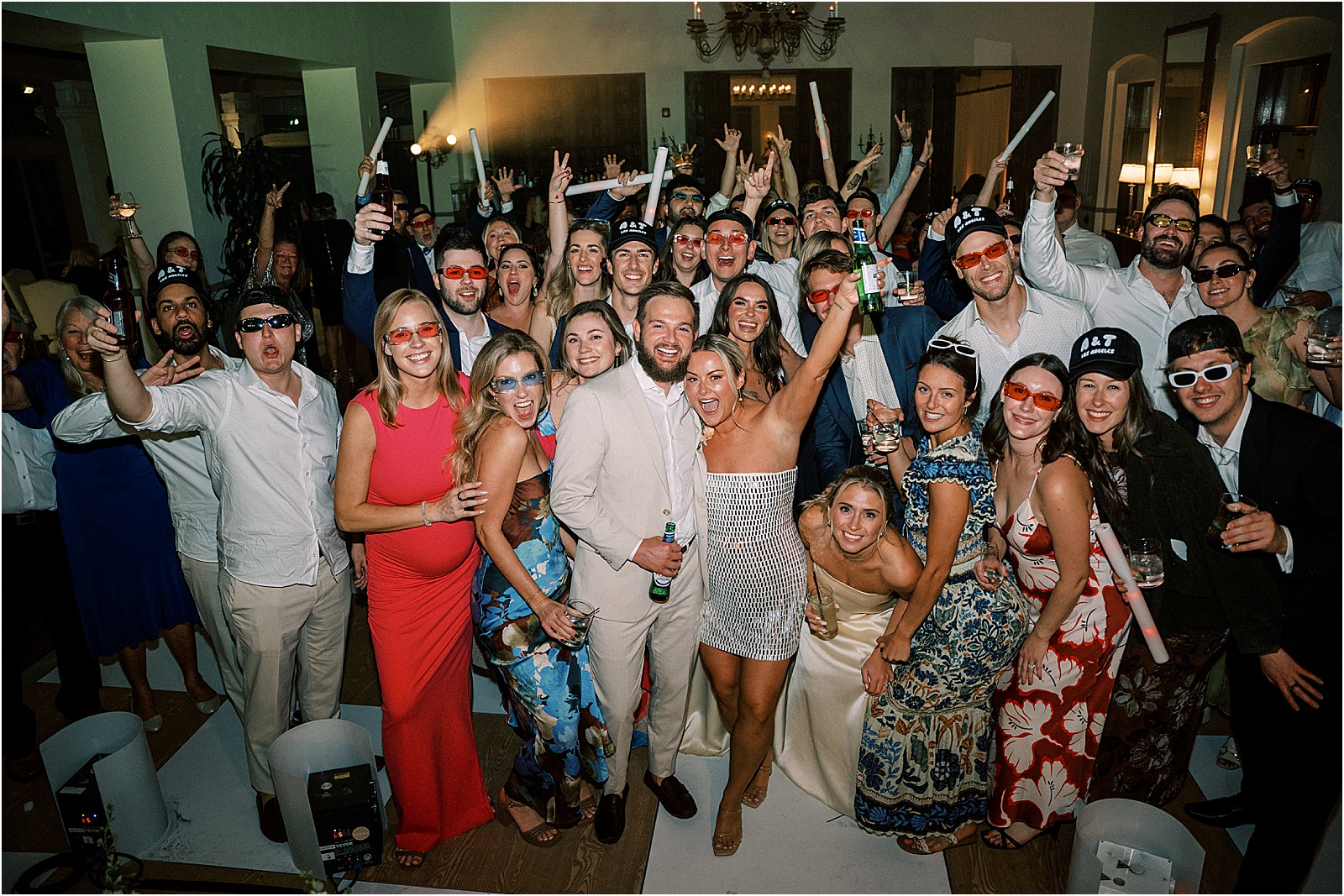 entire dance floor looking at camera for some fun group photos at the reception