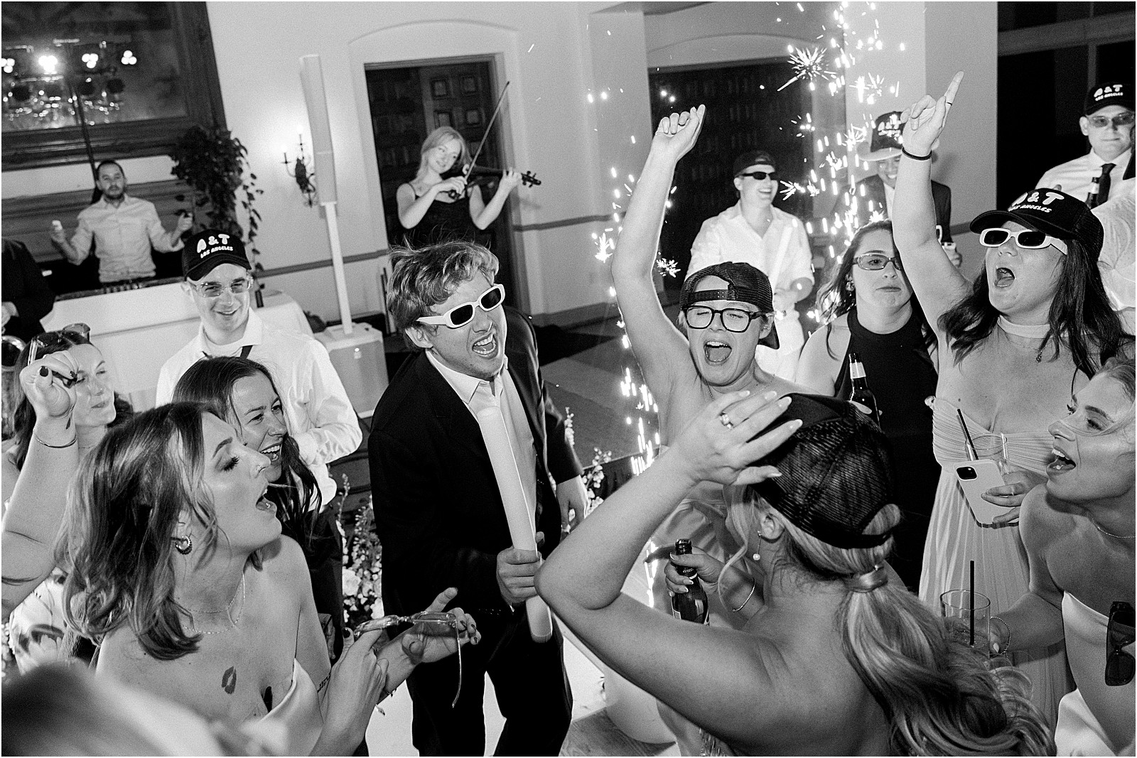 high energy moment with guests jumping and dancing at bel air bay club