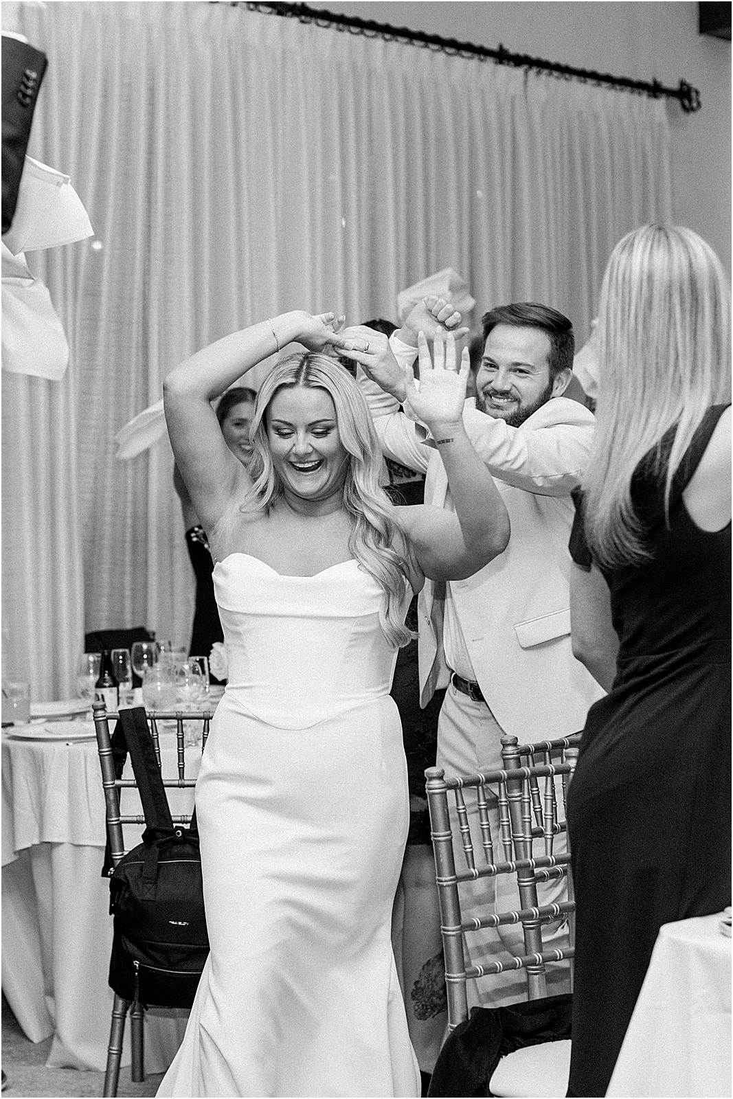 bride and groom welcomed by guests during the grand entrance