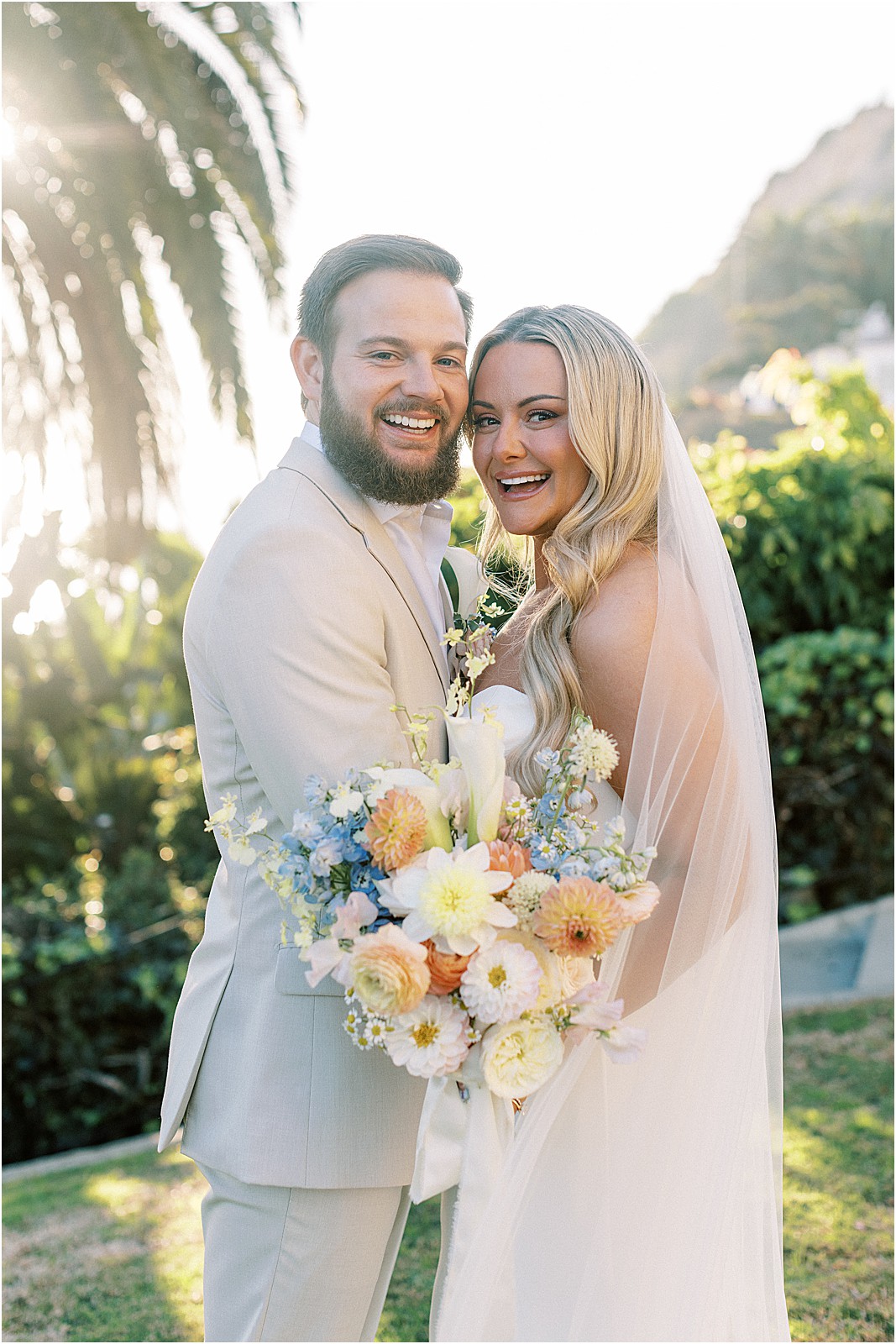 couple squeezing in for a smiling photo