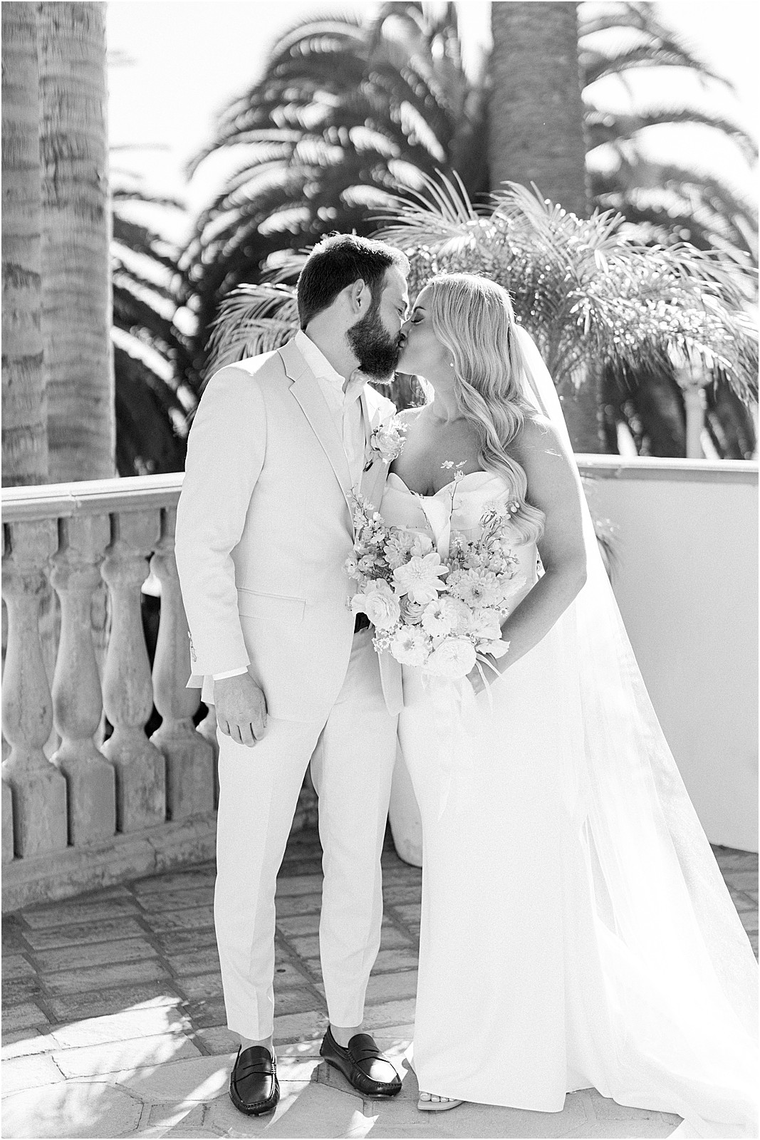 bride and groom sharing a kiss before the ceremony