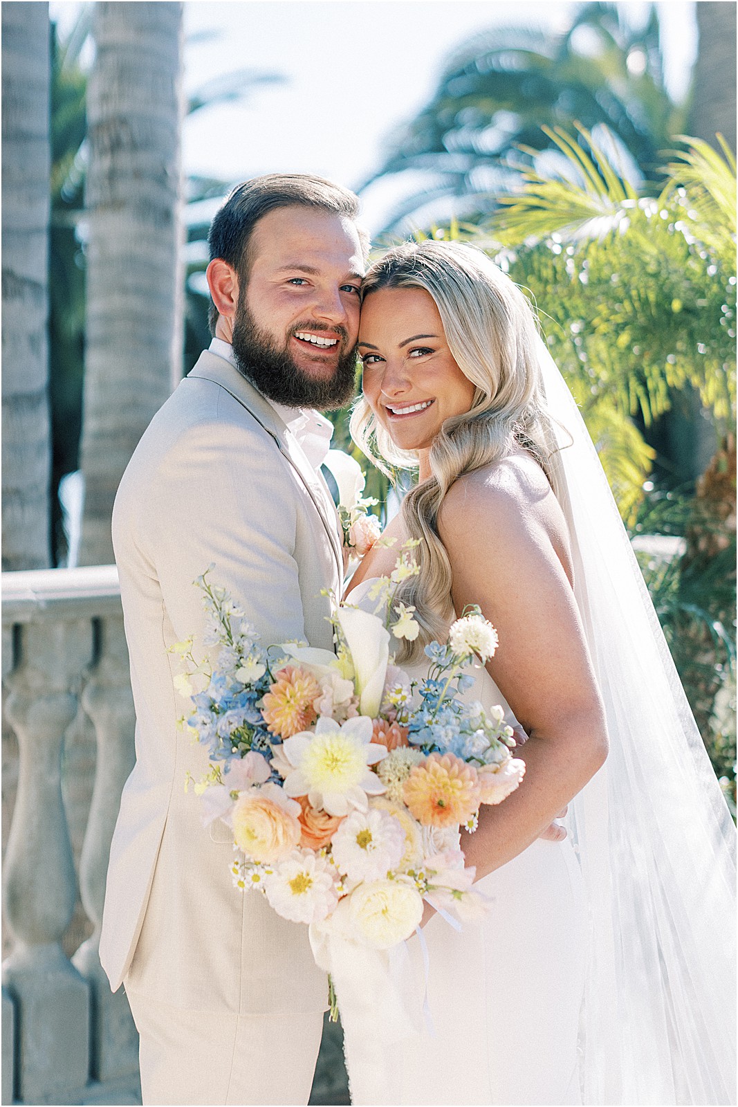 bride and groom posing for a photo at bel air bay club in pacific palisades