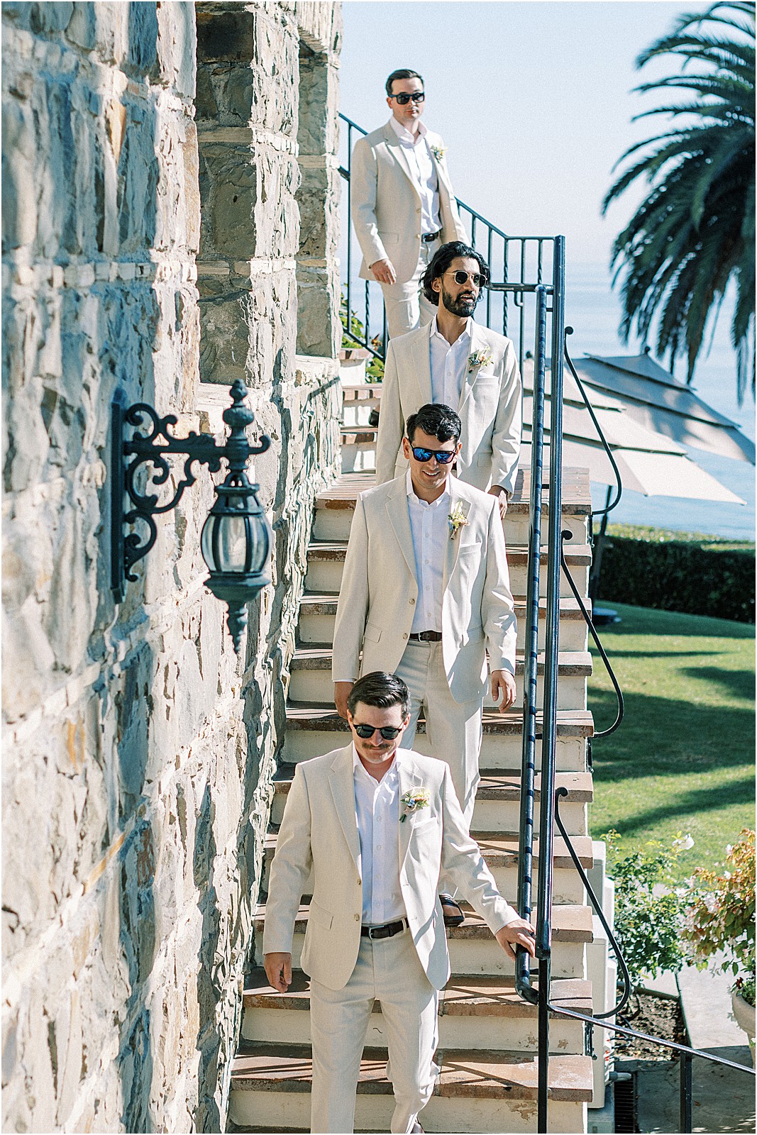 groom and groomsmen walking down stairs