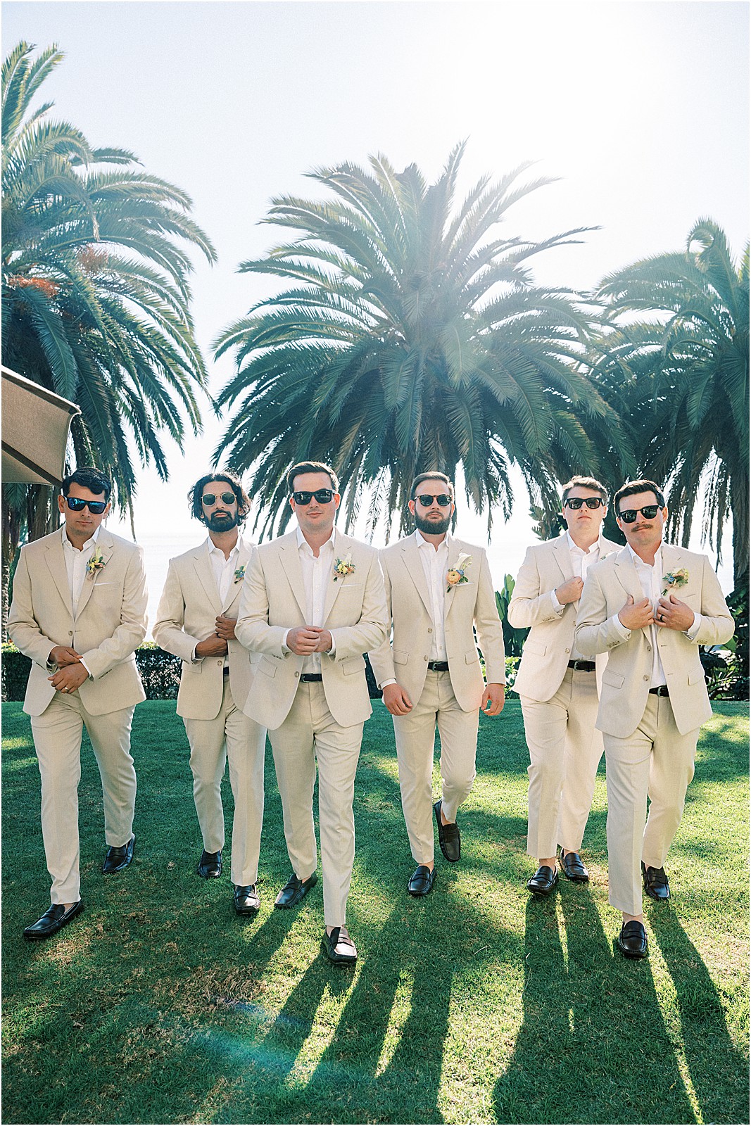 groom and groomsmen in sunglasses before the ceremony